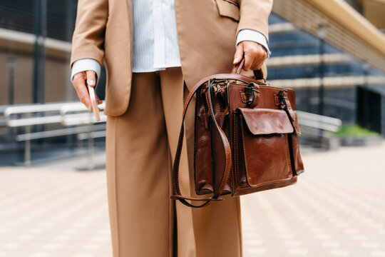 Leather briefcase in women's hands