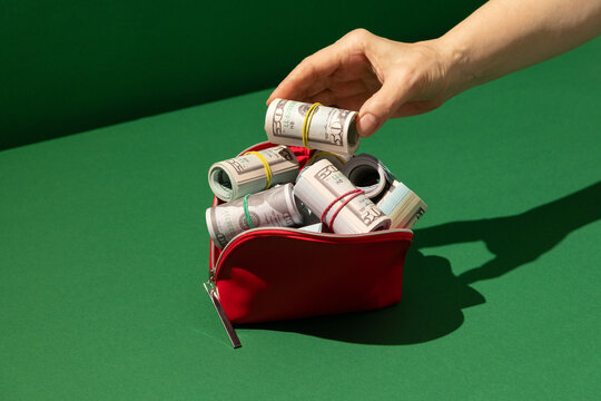 US dollars in red purse, cash, banknotes, money