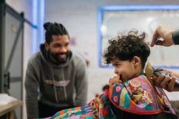 Barber Confidently Cuts Child's Hair