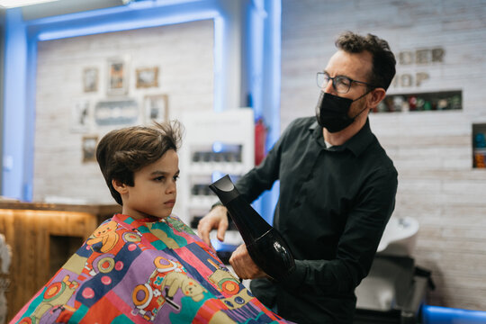 Barber Uses Hair Dryer to Style Child's Hair