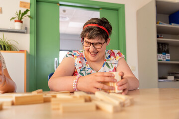 Woman with cognitive challenges triumphs through puzzles.