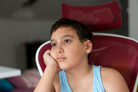 Little boy sitting and thinking