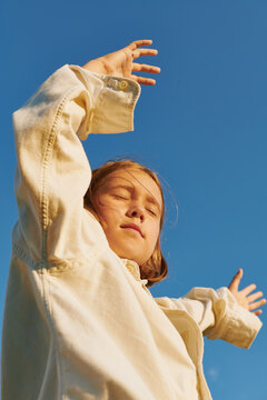 girl dancing in the light of the setting sun