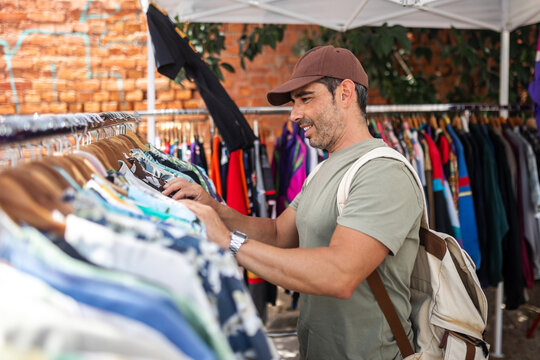 man shopping at a street stall