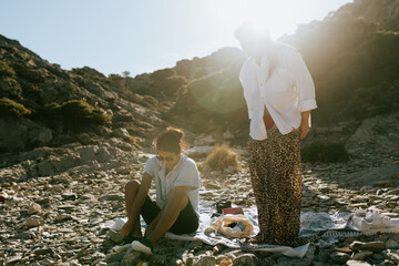 Women Departing from Rocky Beach