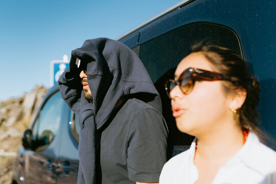 Couple by Van Under Sun