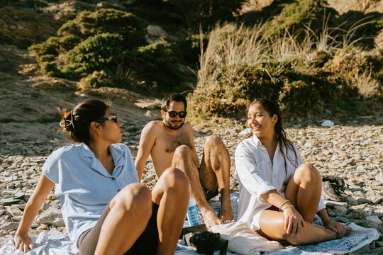 Friends Bonding on Rocky Beach