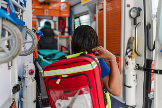 back view of paramedic working in an ambulance