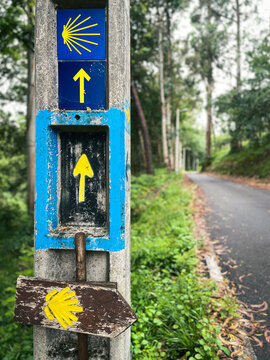 Santiago de Camino shell shaped pointer sign, yellow arrow sign