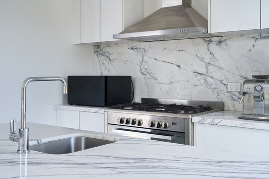 Kitchen with white marble bench