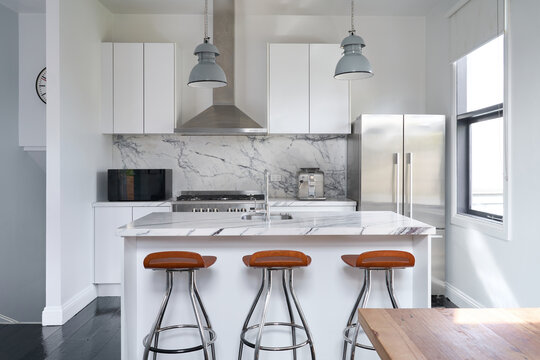 Modern kitchen with marble island bench