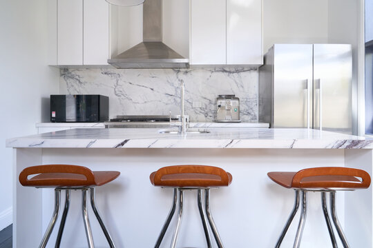 Modern kitchen with island bench and bar stools