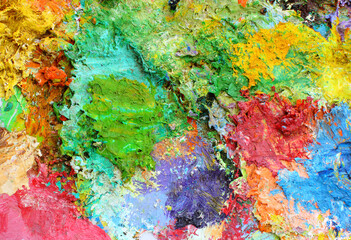 Mixing oil paints on a palette.