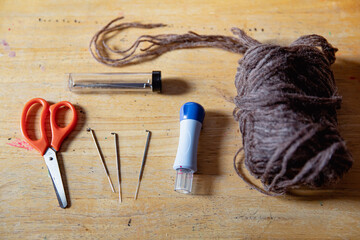 Tabletop filled with equipment needed to make dryer balls