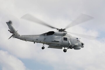 Helicopters in flight, cream colored helicopters taking off, luxury lifestyle, holiday tours