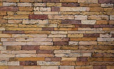 Beautiful yellow block brick wall suitable for use as a background.