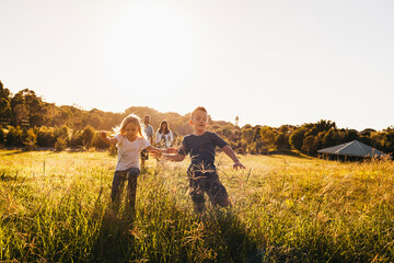 Young siblings running