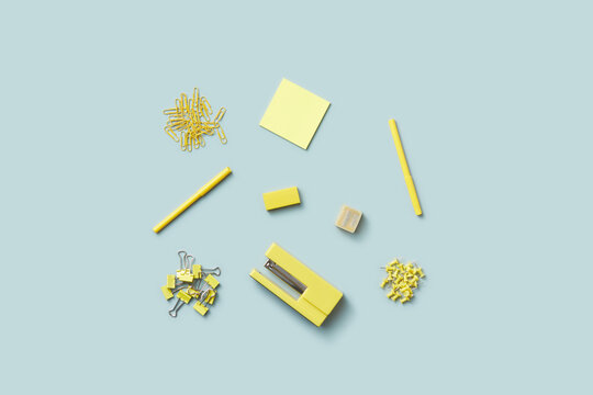 Yellow-colored school stationery on gray-blue background.