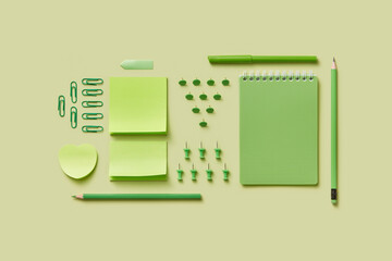 Bright green colored composition with various stationery.