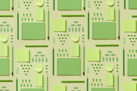 Pattern featuring stationery essentials in green colors.