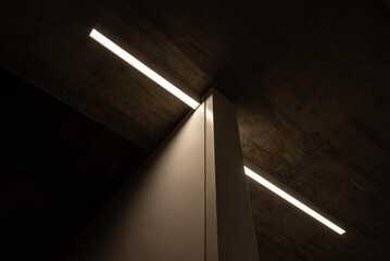 Modern indoor lighting setup in a concrete made ceiling