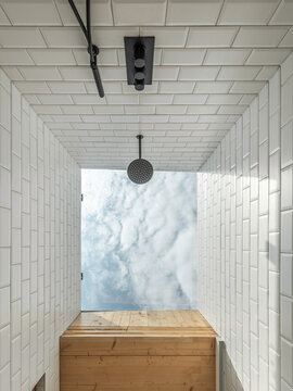 Nadir view of modern bathroom interior with the sky at the center