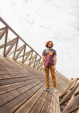 Standing man on leaning scenery
