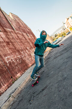 Surreal skater surfing on steep street