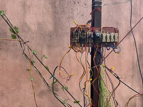 External switching system hanging in a rusted pole unsafely