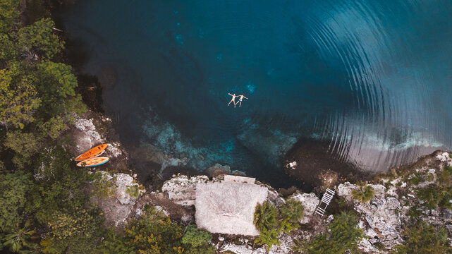 family floating in lake
