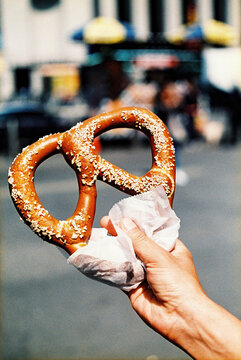 man with a pretzel in his hand, 35 mm