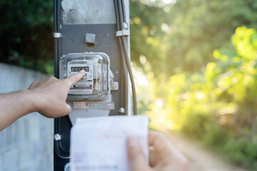checking the electricity meter