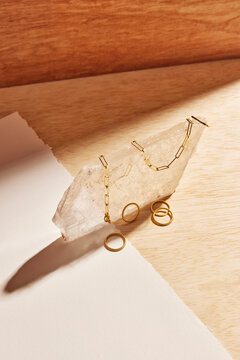 Assorted jewelry on top of a large crystal