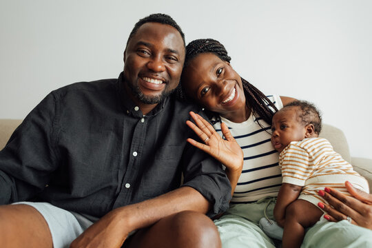 Family with Newborn Baby on Video Call