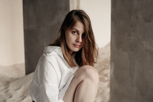 Woman looks longingly into the camera