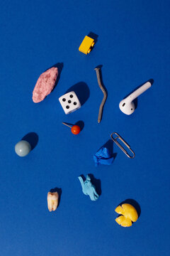 Everyday items: candy, tooth, paper clip, bubblegum, pound and dice