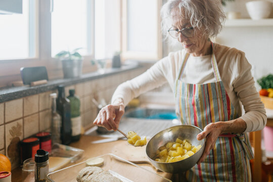 Senior woman cooking in the kitchen