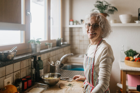 Senior Woman Cooking In The Kitchen