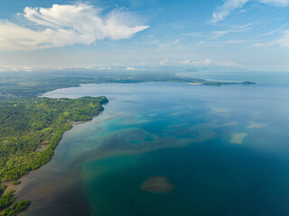 Fototapeta na wymiar Beautiful tropical island with turquoise water in sea bay. Mindanao, Philippines.