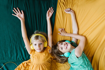 Two girls listening to music