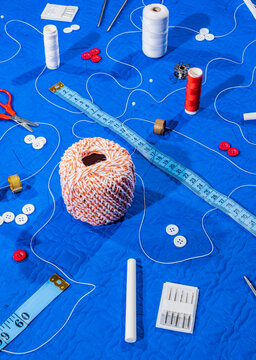 Scattered threads and tailoring equipment.