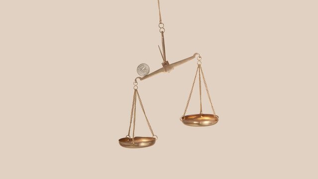 Golden scales with rolling and balancing cent coin.