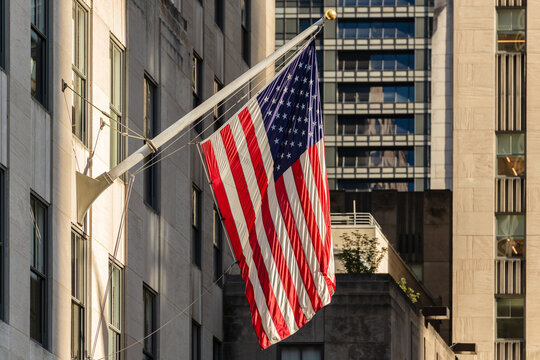 American Flag Hanging Outside Hi Rise Building