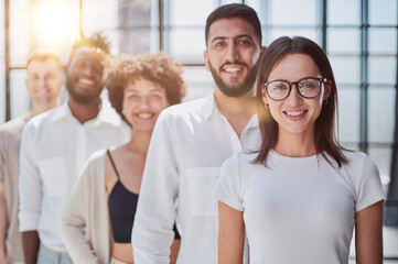 Smiling professional business leaders and employees group team portrait