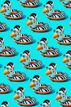 pattern of zebra-shaped swim rings using sunglasses
