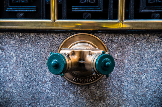Fire hydrant on wall in city