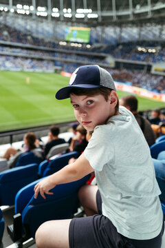 Boy spectator at footbal match.