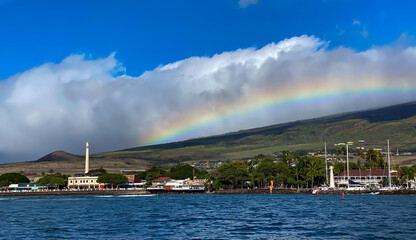 A rainbow over the coastline of the historic whaling village in Lahaina, Maui, Hawaii