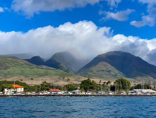 Clouds over the West Maui mountains as seen from the Lahaina Harbor in Hawaii