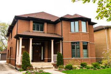 cottage house in american neighborhood. suburban house property. real estate. architectural house in suburban america. house apartment in suburb. suburban neighborhood. Suburban community